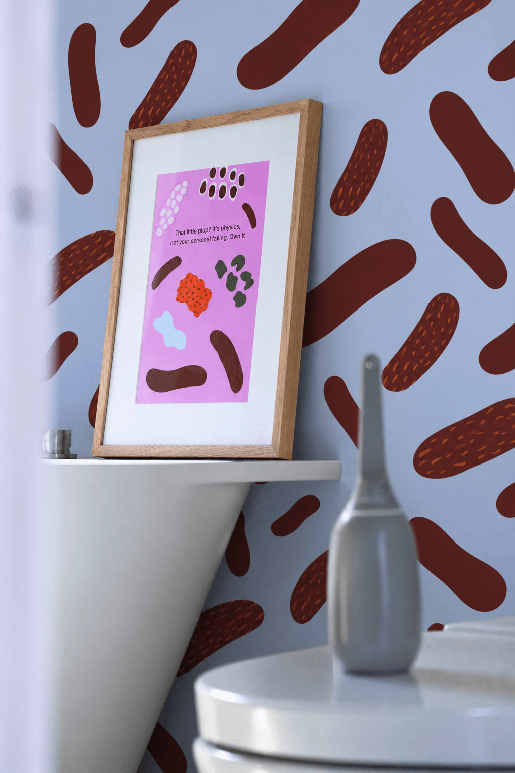 Moley Own Your Plop poster framed above a toilet